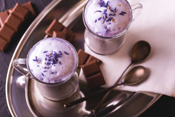 Cappuccino with lavender and chocolate syrup and flowers