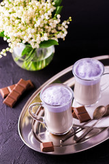 Cappuccino with lavender and chocolate syrup and flowers