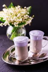 Cappuccino with lavender and chocolate syrup and flowers