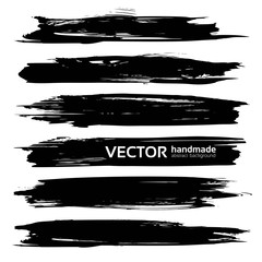 Big black long ink strokes isolated on a white background