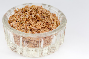 Wheat bran (Triticum aestivum) isolated on white background