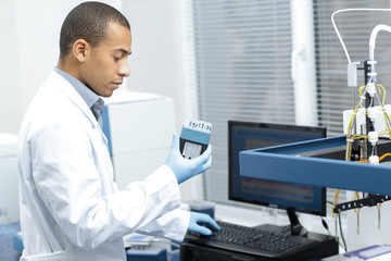 Young African researcher working at the laboratory