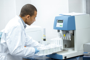 Young African researcher working at the laboratory