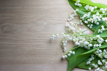 Lily of the valley wood background
