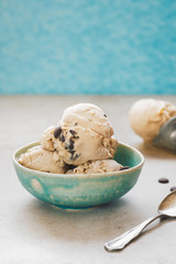 Ice cream in a bowl. Homemade ice cream with chocolate chip cookies. Selective focus, vintage toned image, blank space
