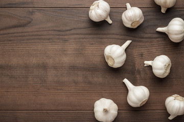 fresh garlic on the brown wooden table