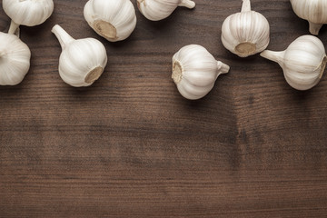 fresh garlic on the brown wooden table