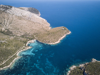 Aerial view of the Sardinian Emerald Coast, with its turquoise sea. in Sardinia Island, is one of the most beautiful and famous coasts in the world