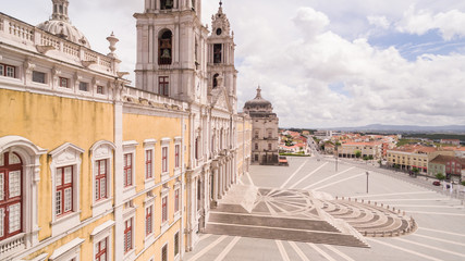 Main facade of the royal palace in Mafra, Portugal, May 10, 2017. Aerial view.