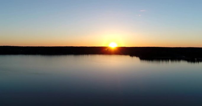 Lake bodom Cinema 4k aerial flight over Bodomjarvi, on a sunny spring evening, in Espoo, Finland