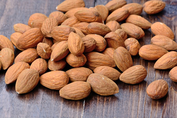 Group of almonds on wooden table