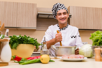 Young chef working in the kitchen