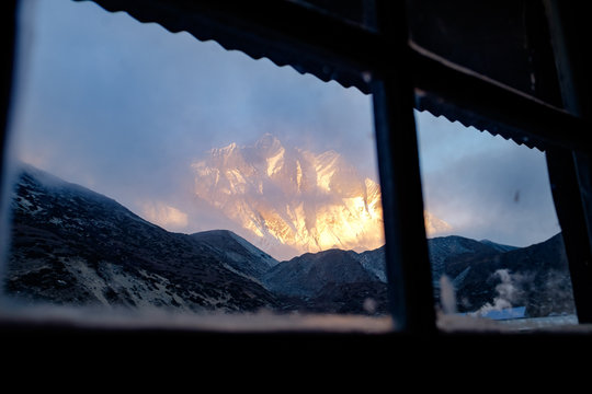 Sunset Over South Face Of Lhotse Visible From Window, In Himalaya, Nepal