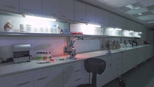 Biotechnology laboratory table. Medical research laboratory bench. Microbiologist working place. Steadyshot biomedical scientist workspace. Scientist view laboratory work place. Empty laboratory room