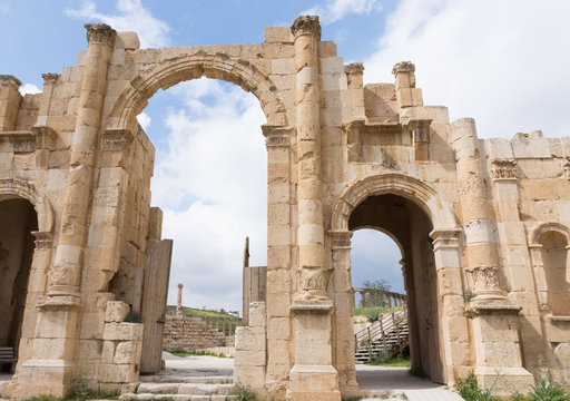 Eleven meter high three arched gate with acanthus bases, capitals at the bottom of the columns, built to honor Roman Emperor Hadrian's visit to Jerash in year 129. Built with Nabataean influence.