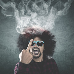 Afro man showing middle finger