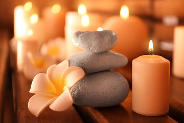 Fototapeta na wymiar Beautiful spa setting with candles, closeup