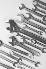 Set of spanners and screw wrenches on white background
