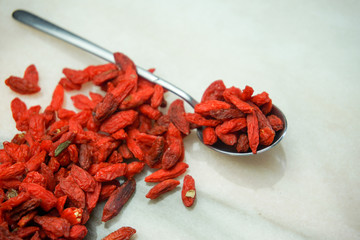 heap of goji berries isolated on white background.top view