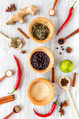 Cooking with spices, salt and pepper on kitchen table background top view
