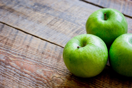 ripe green apples wooden table background space for text