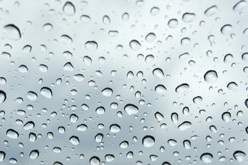 Close up of Rain drops on windscreen glass. / water drops on glass.