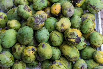 Fresh organic mangoes fruit on a traditional market of Bali island, Sukawati, Indonesia.