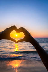 Female hands in heart shape