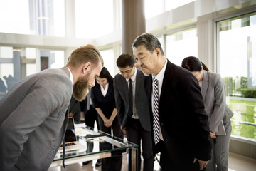 Business Partners Introductionary Handshake Bow