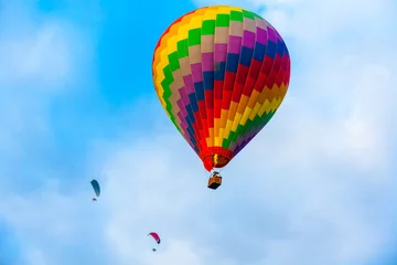 colorful hot air balloon with paramoter fly on blue sky