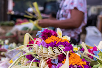 Offerings to gods in Bali with flowers. Exotic tropical Bali island, Indonesia.