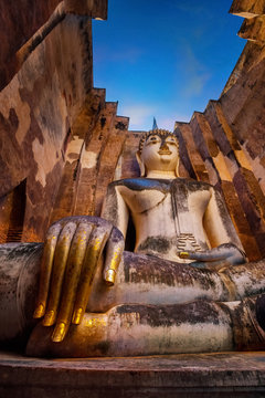 Seated Buddha image at  Wat Si Chum temple in Sukhothai  Historical Park, a UNESCO world heritage site, Thailand