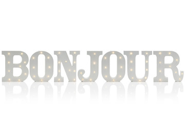 Illuminated Decorative Letters Spelling BONJOUR Over White Background © photographyfirm