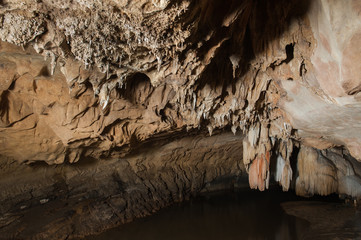 Stalactites and stalagmites in a cave,at national park of Thailand