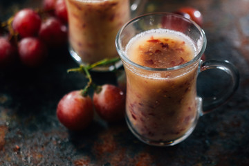Grape smoothie over black metal board