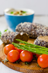 Fresh asparagus, bread and tomatoes