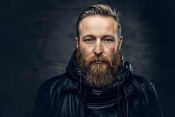 Obraz premium Redhead bearded male in leather jacket.