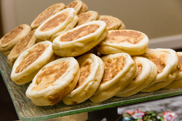 Obraz na płótnie Canvas Tray of warm English muffins in serving line