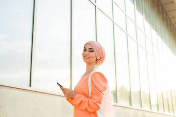 beautiful arabian girl with tablet computer. Muslim woman.