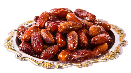 Beautiful Dates fruit on a silver tray isolation on white background. The Muslim feast of the holy month of Ramadan Kareem.