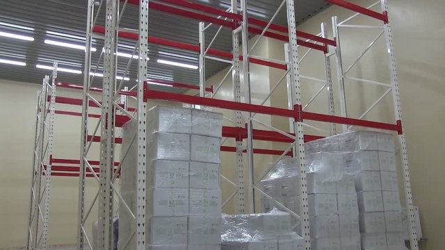 Warehouse at the Enterprise with Shelves and White Sacks and Boxes