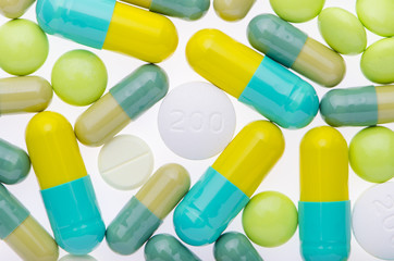  green pills background on the white