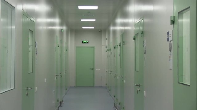 Light Corridor with Green Doors at the Hospital
