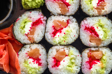 The plate of sushi with soy sauce, wasabi