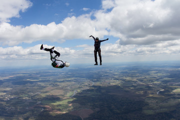 Two skydivers in the sky