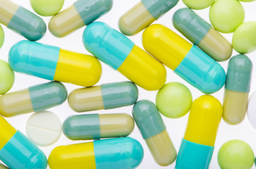  green pills background on the white