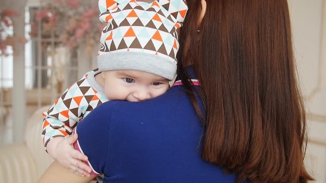 Mom hugs the baby boy