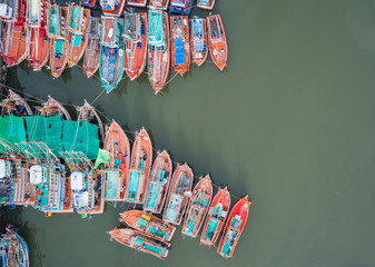 The big fishing boats standing at the sea in Phuket, Thailand