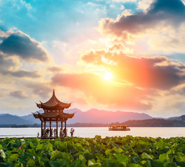 ancient pavilion of Hangzhou west lake at dusk, in China