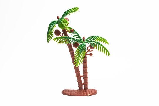 Palm tree plastic toy image on white background